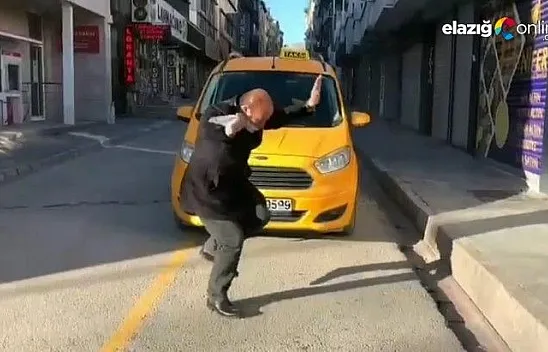 Müziğin ritmine kendini kaptıran taksici gülümsetti