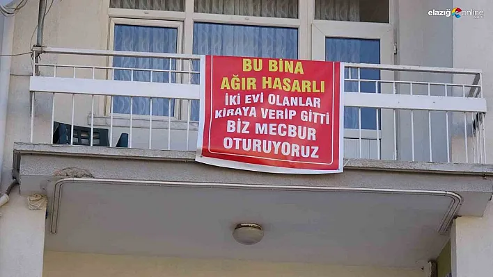 Ağır hasarlı pankartı asılan binayı görenler bir daha bakıyor