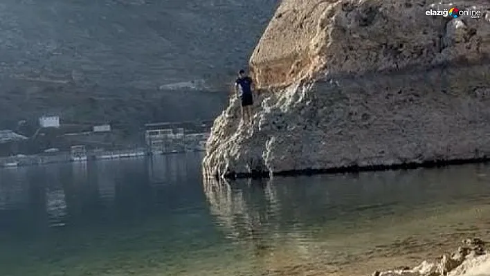 Dağcı soğuk havaya aldırış etmeden baraj gölüne atladı