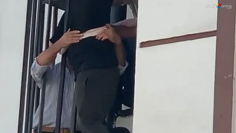 Sıkışan adam düşmemek için çarşafa tutundu